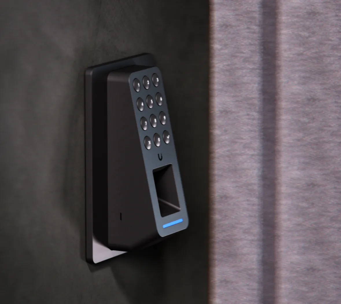 UA-Retrofit-Reader-Fingerprint-B black OSDP fingerprint reader on a wall