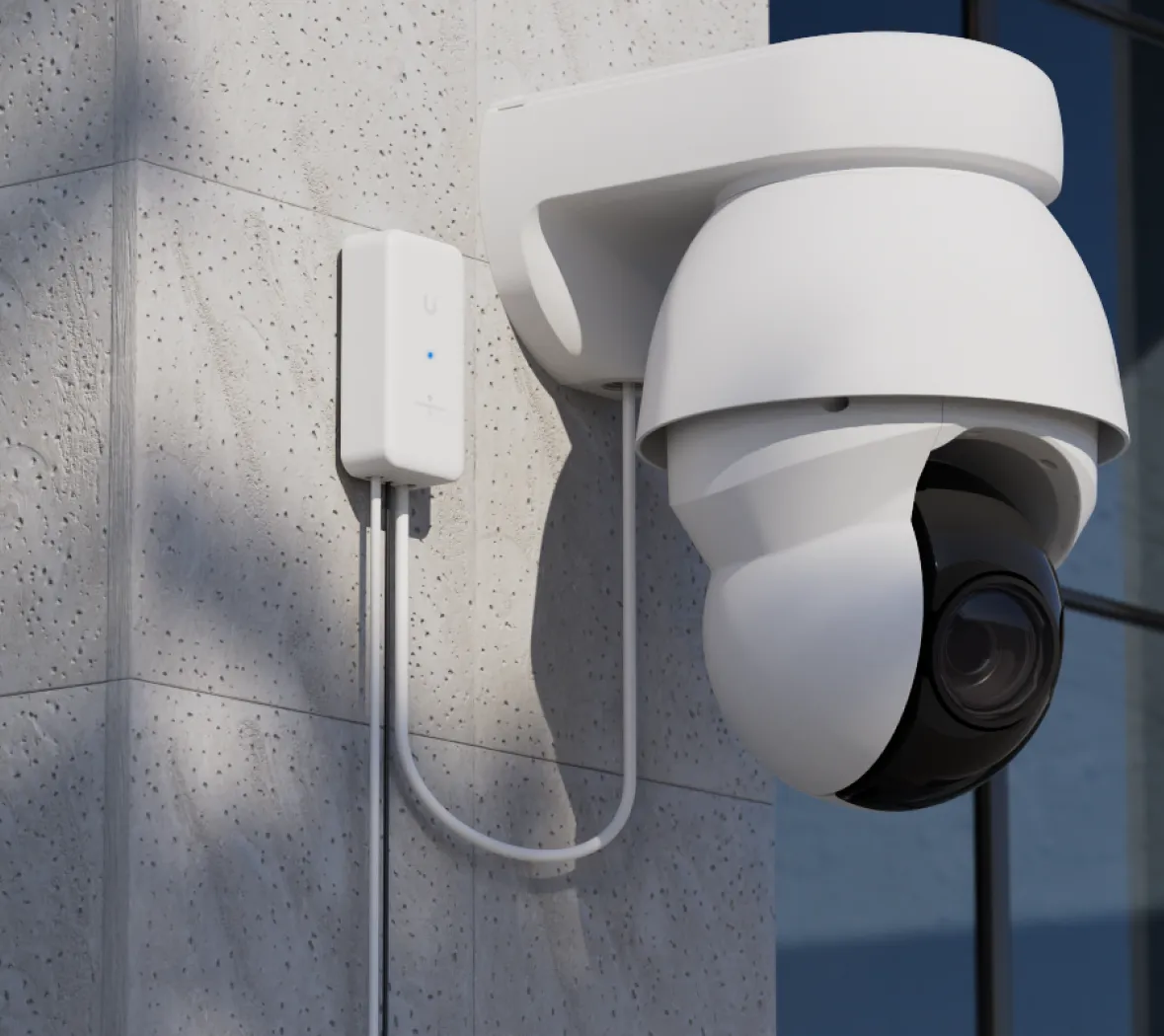 Outdoor Long-Range Endpoint wall mounted beside a UniFi PTZ camera