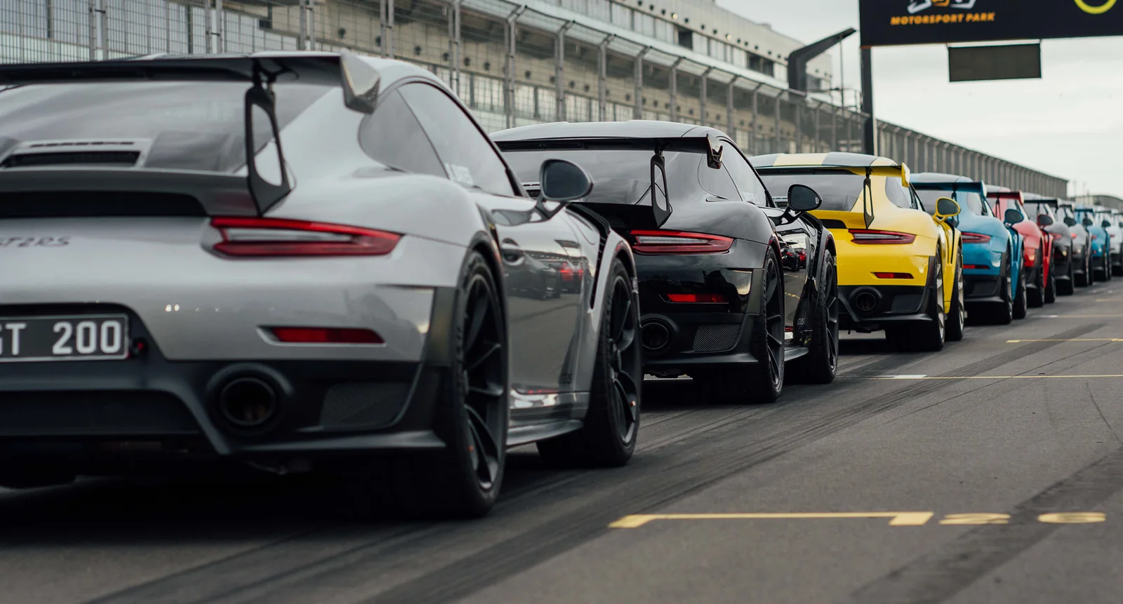 Sports cars lined up on the pit straight at The Bend Motorsport Park, South Australia