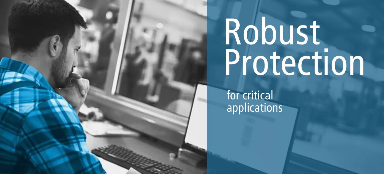 Engineer at a control workstation with the PowerShield message Robust Protection for critical applications