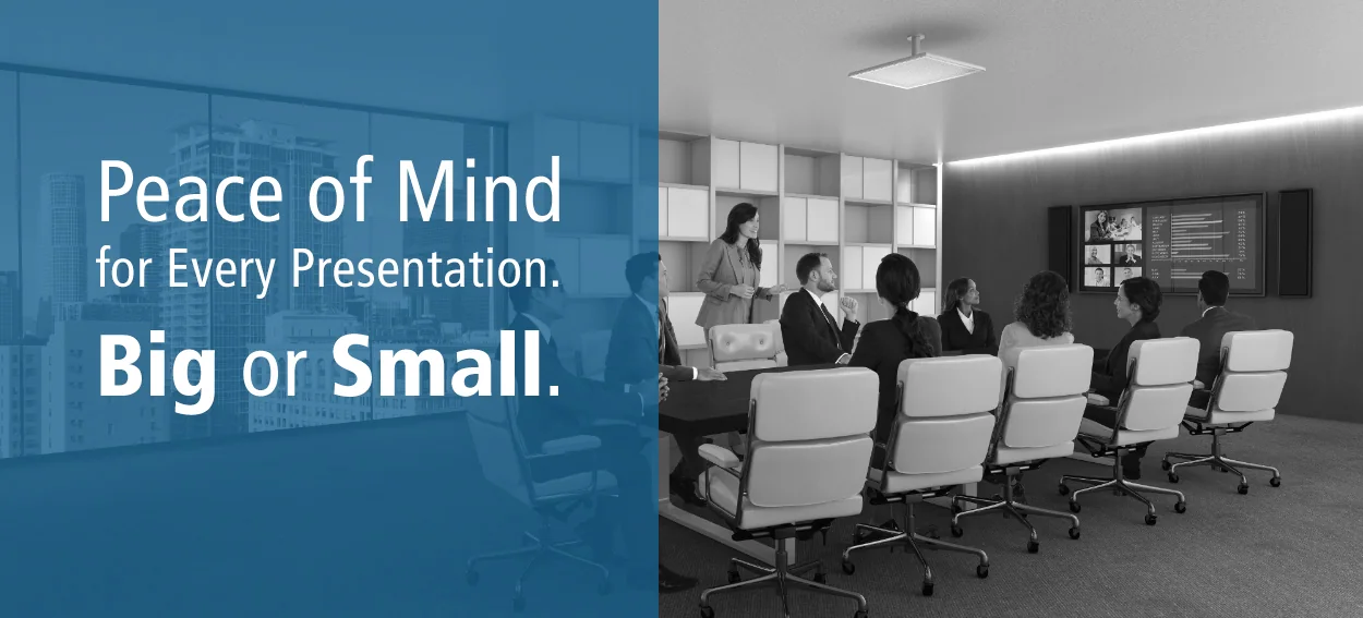 Corporate presentation room with a projected screen and PowerShield message Peace of Mind for Every Presentation