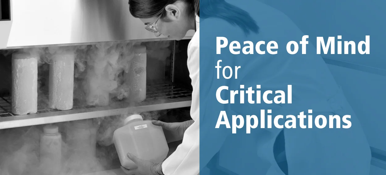 Laboratory worker taking samples from cold storage beside the words Peace of Mind for Critical Applications