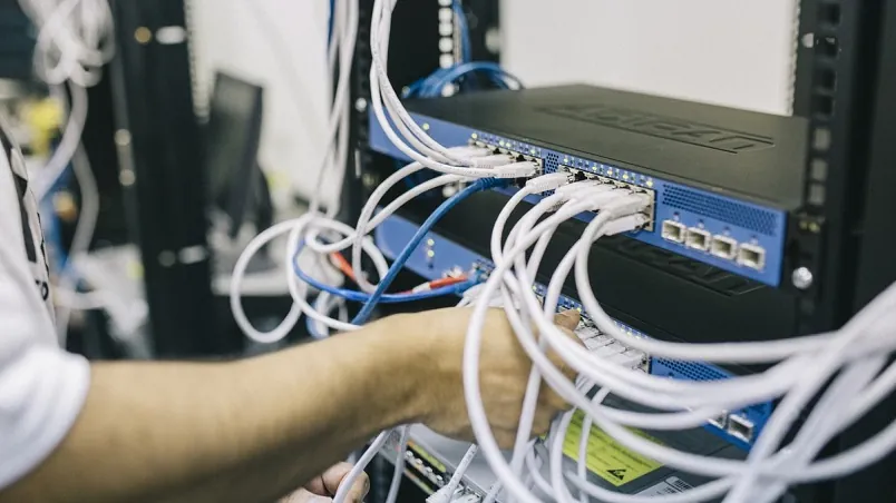 Network cables patched into a server rack switch, protected by a PowerShield rackmount UPS