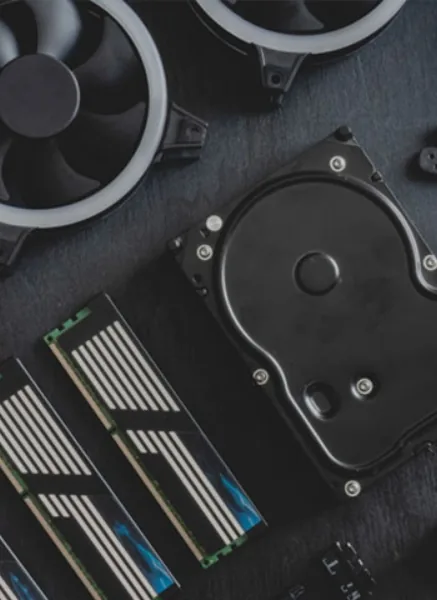 Inside an ASUSTOR NAS build: a 3.5-inch hard drive, M.2 NVMe SSDs with heatsinks and cooling fans