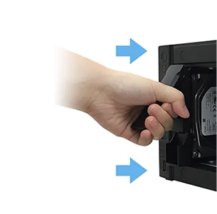 Sliding a drive tray into an ASUSTOR NAS by hand