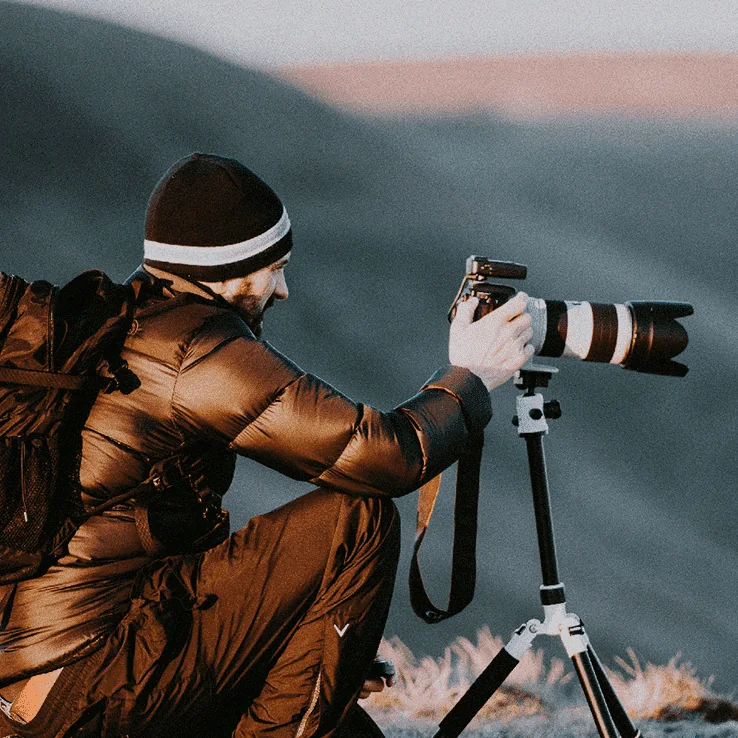 Photographer shooting on location with a tripod