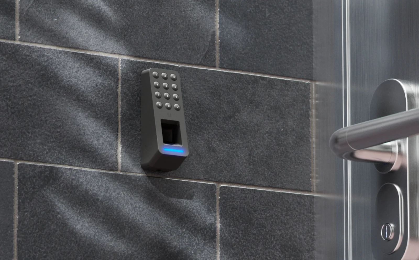 Black Ubiquiti UniFi Access G3 Reader Fingerprint mounted on a tiled wall beside a door handle