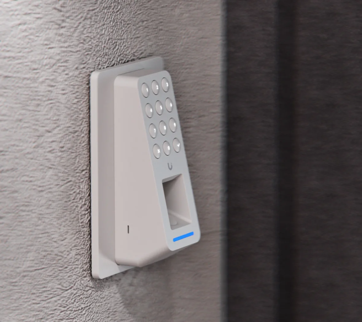 White Ubiquiti Retrofit Reader Fingerprint mounted on a rendered wall