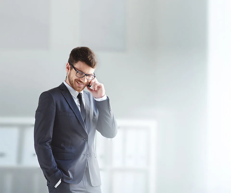 Manager taking a call on a Yealink phone