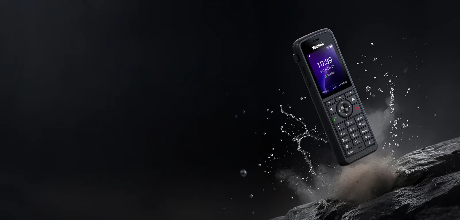 Yealink AX86R rugged Wi-Fi phone splashed with water and dust on rock