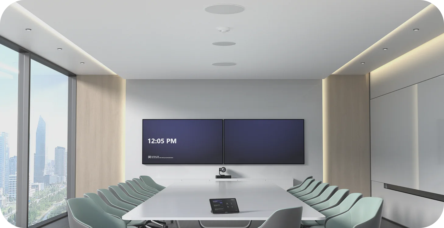 Large Yealink Teams Room with dual displays, a camera at the front and ceiling microphones over the table