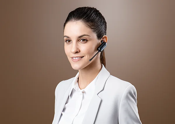 Woman wearing a Yealink convertible DECT headset with ear tips only
