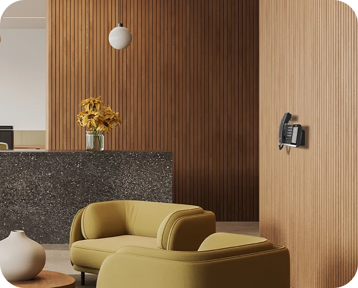 Yealink MP54 E2 Teams phone wall-mounted in a building lobby