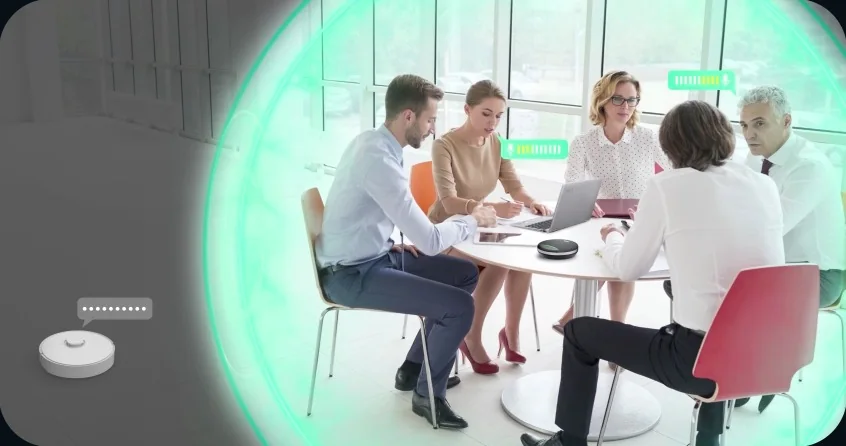Small team meeting around a table with a Yealink SP92 speakerphone